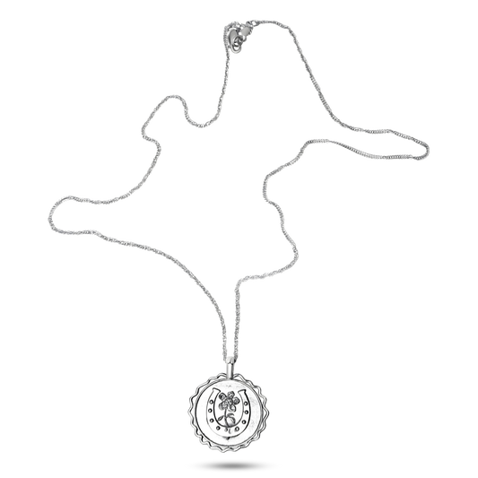 The Good Luck Amulet – Delicate horseshoe pendant necklace, crafted in sterling silver for timeless equestrian style. Wax seal stamped sterling silver amulet with daisy sprouting from the middle of a horseshoe